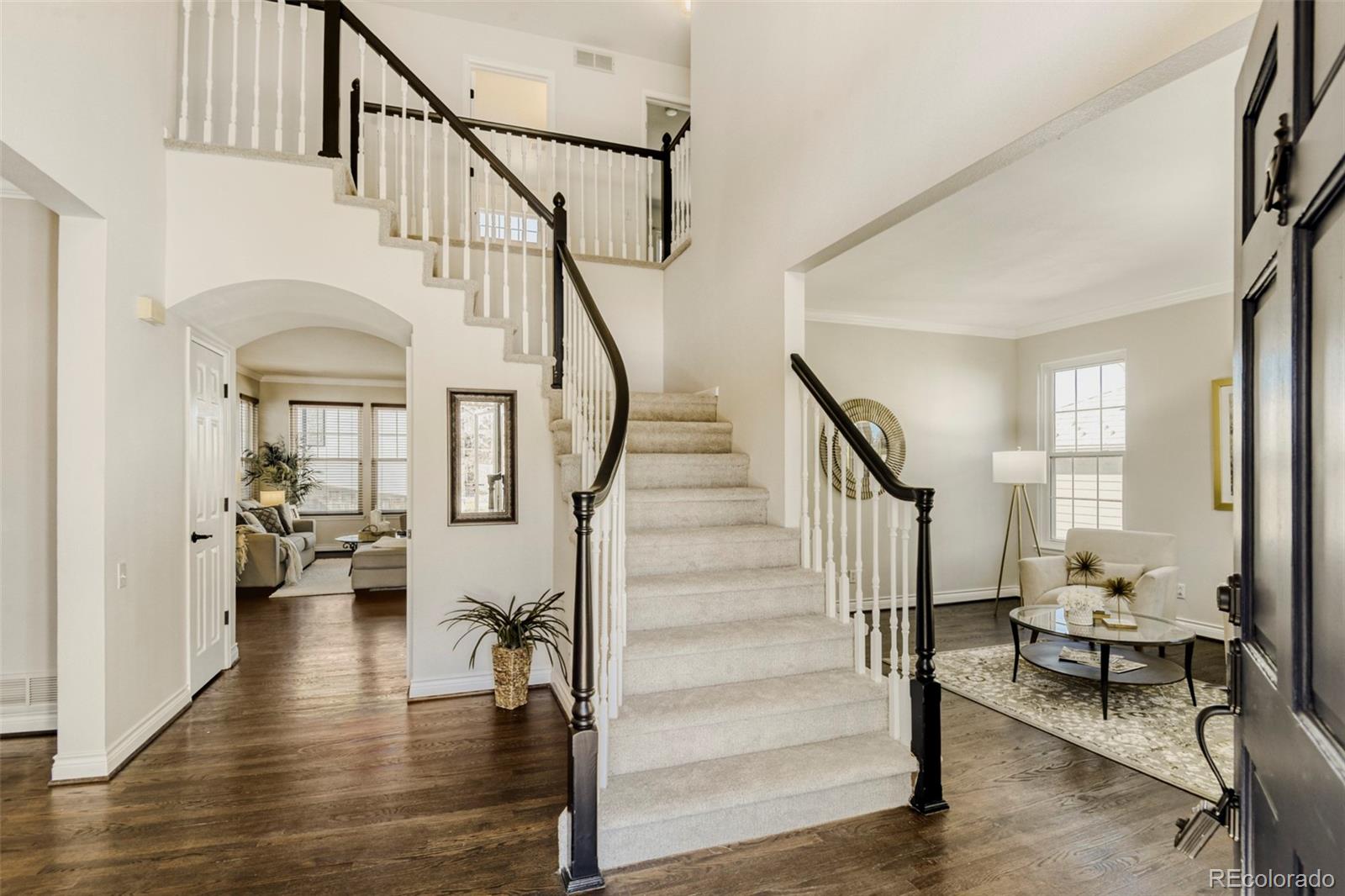 8573 South Mallard Court Highlands Ranch, CO 80126 - Photo 4 of 50 a view of entryway and hall with wooden floor