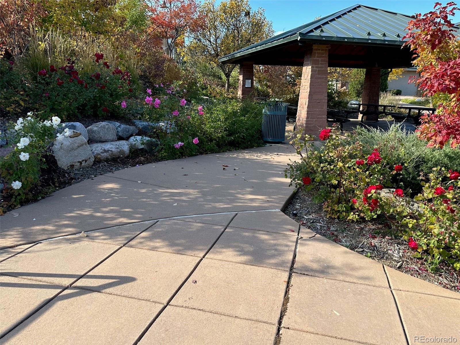 8573 South Mallard Court Highlands Ranch, CO 80126 - Photo 48 of 50 a view of a pathway with a flower garden