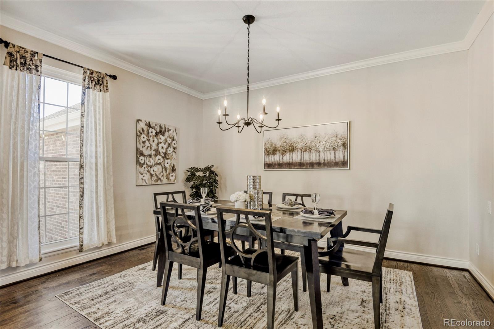 8573 South Mallard Court Highlands Ranch, CO 80126 - Photo 7 of 50 a view of a dining room with furniture window and wooden floor