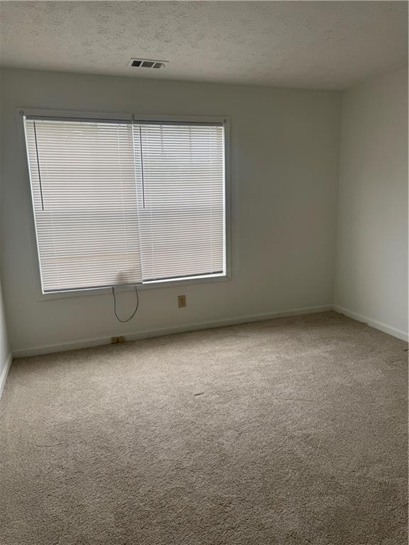 682 Bridge Way Lithonia, GA 30058 - Photo 20 of 25 an empty room with a window