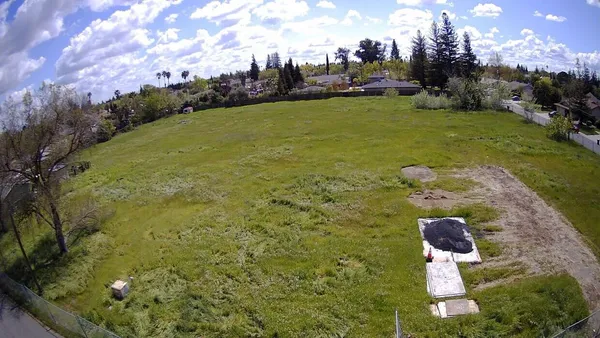 a aerial view of a house with a yard