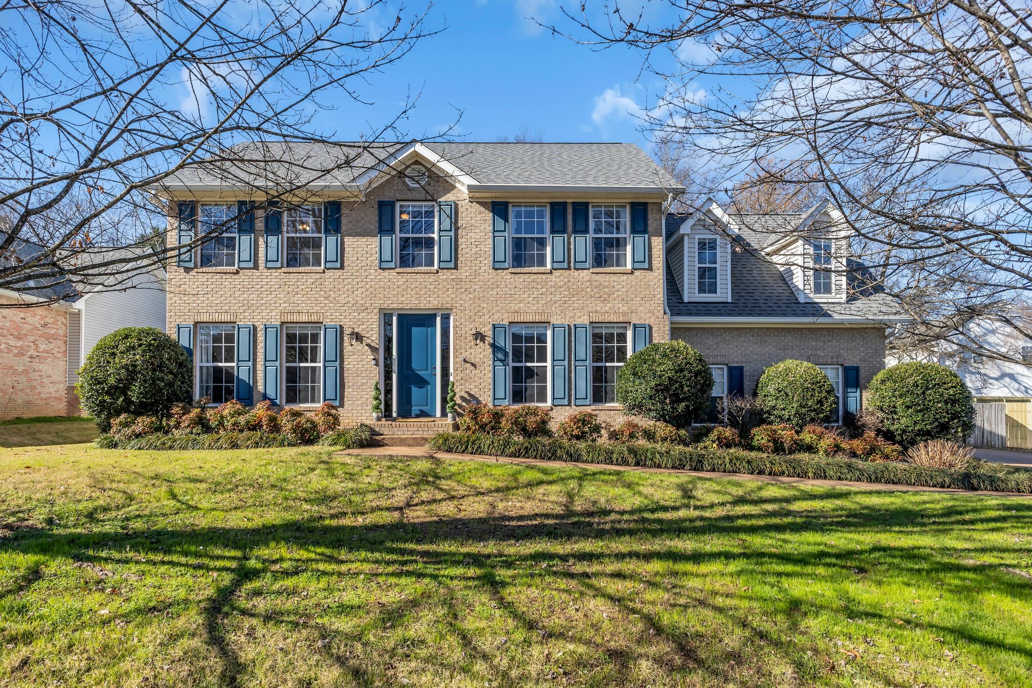 a front view of a house with a yard