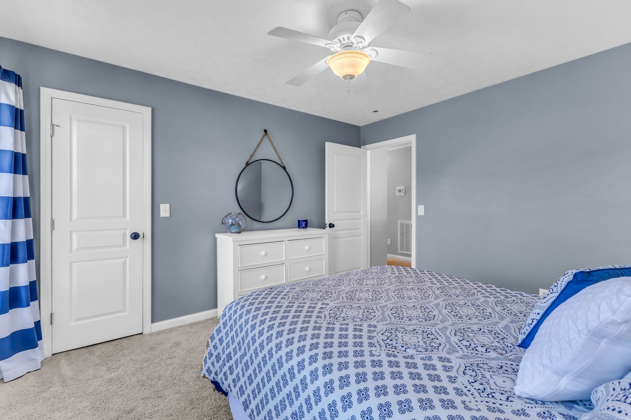 2005 Trenton Drive Spring Hill, TN 37174 - Photo 27 of 35 a bedroom with a bed and a chandelier