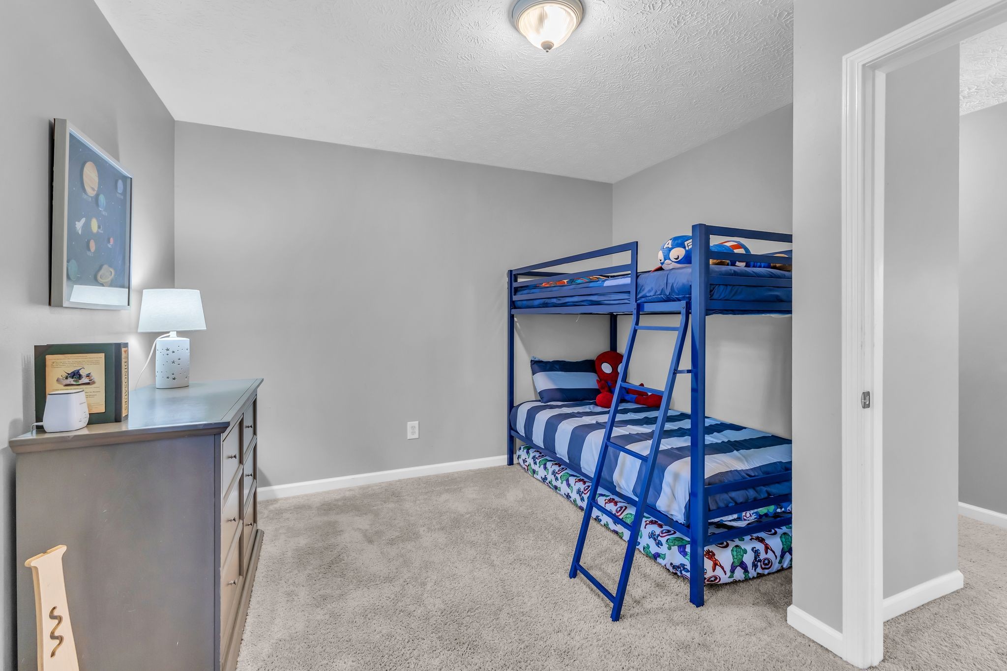 2005 Trenton Drive Spring Hill, TN 37174 - Photo 28 of 35 a bedroom with a bed and a chandelier