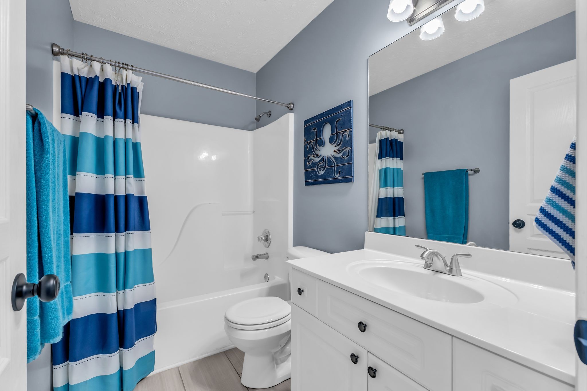 2005 Trenton Drive Spring Hill, TN 37174 - Photo 30 of 35 a bathroom with a toilet a sink and a large mirror