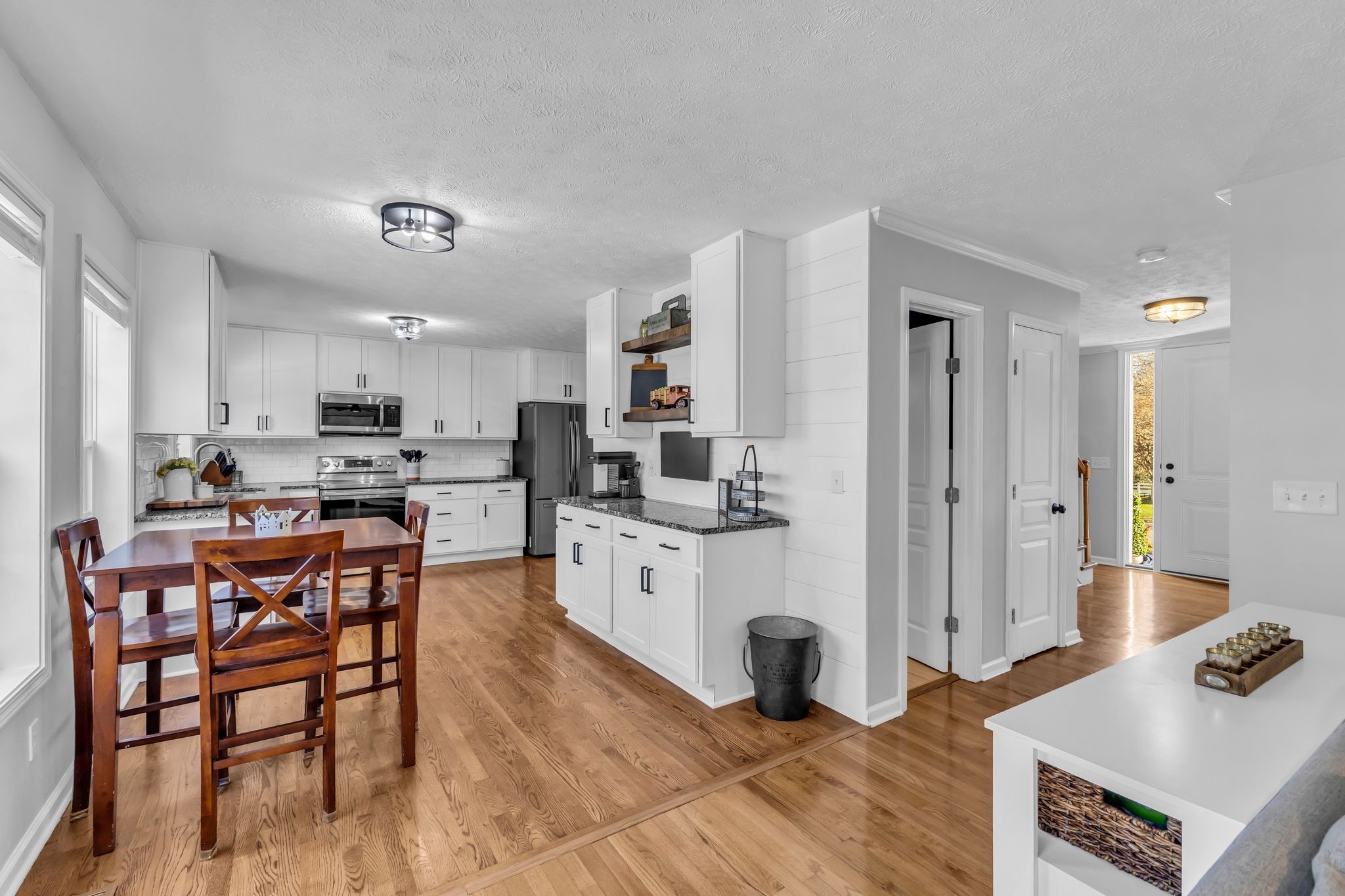 2005 Trenton Drive Spring Hill, TN 37174 - Photo 6 of 35 a large white kitchen with stainless steel appliances lots of counter space and windows