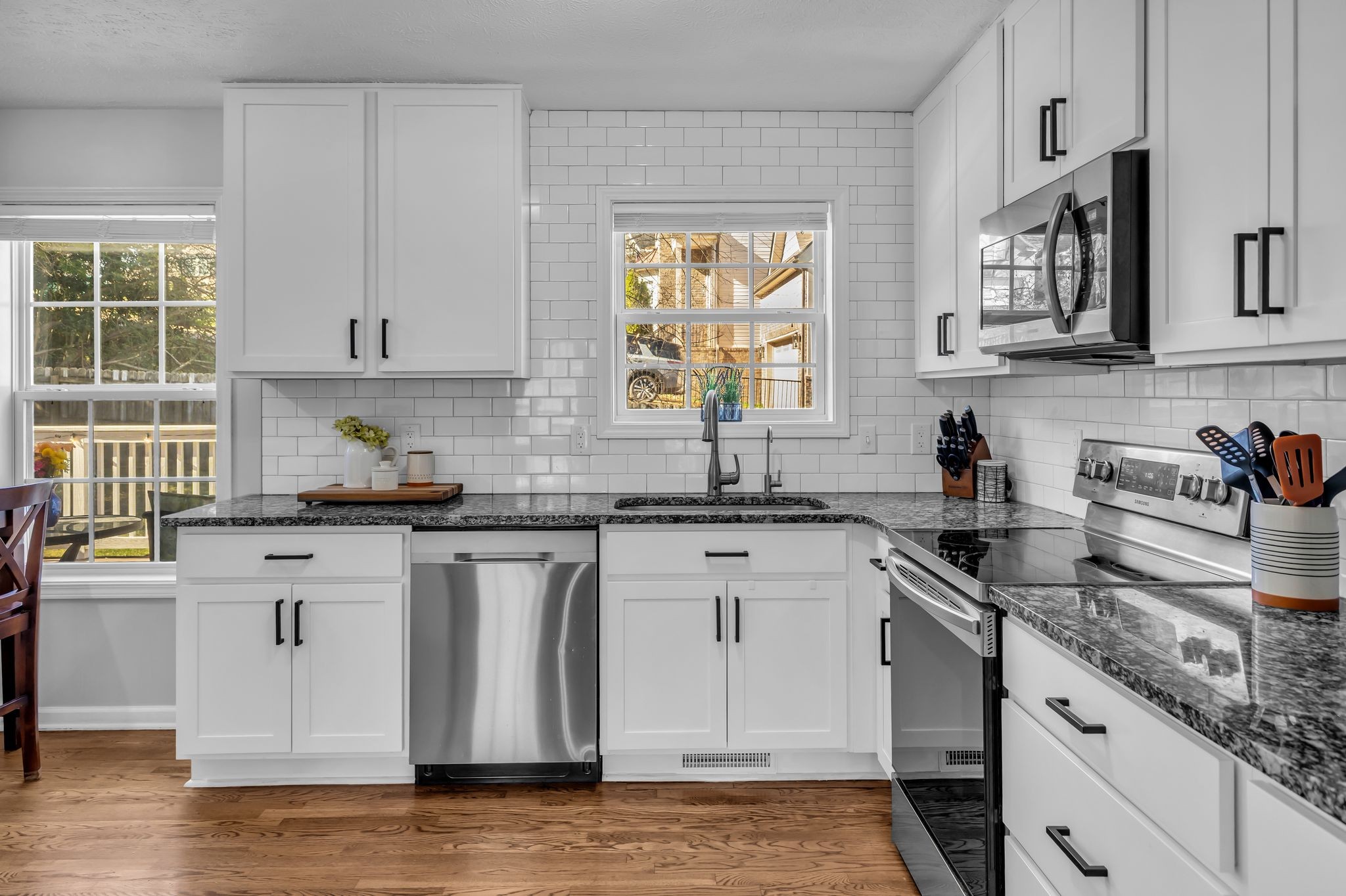 2005 Trenton Drive Spring Hill, TN 37174 - Photo 9 of 35 a kitchen with stainless steel appliances granite countertop a sink stove and cabinets