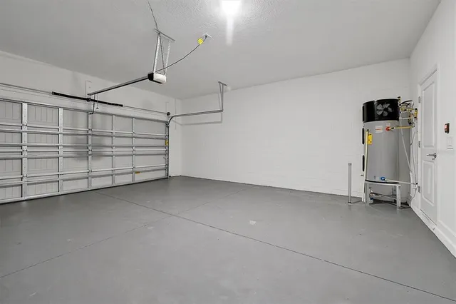 a view of a room with air conditioner duct and materials on floor