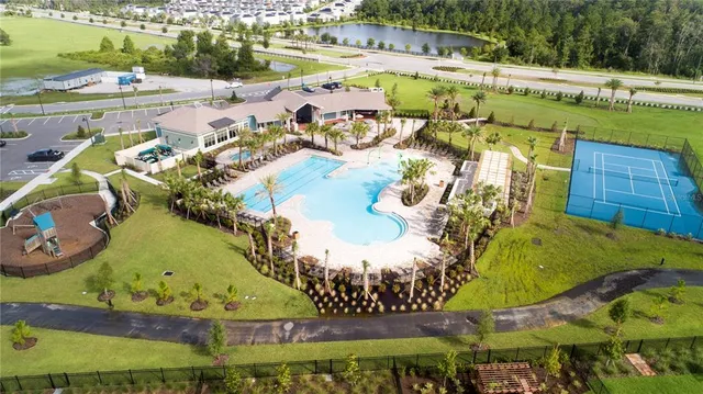 an aerial view of residential houses with outdoor space