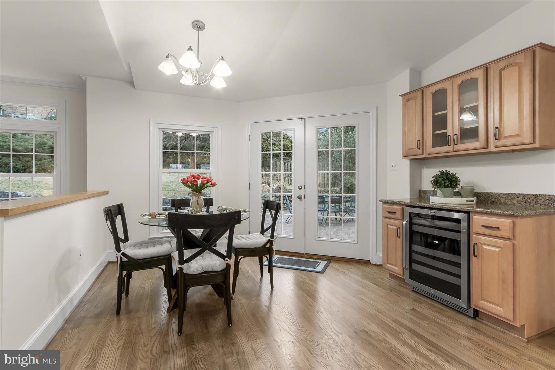 6011 Walhonding Road Bethesda, MD 20816 - Photo 13 of 51 Breakfast room with wine fridge. Exit to patio
