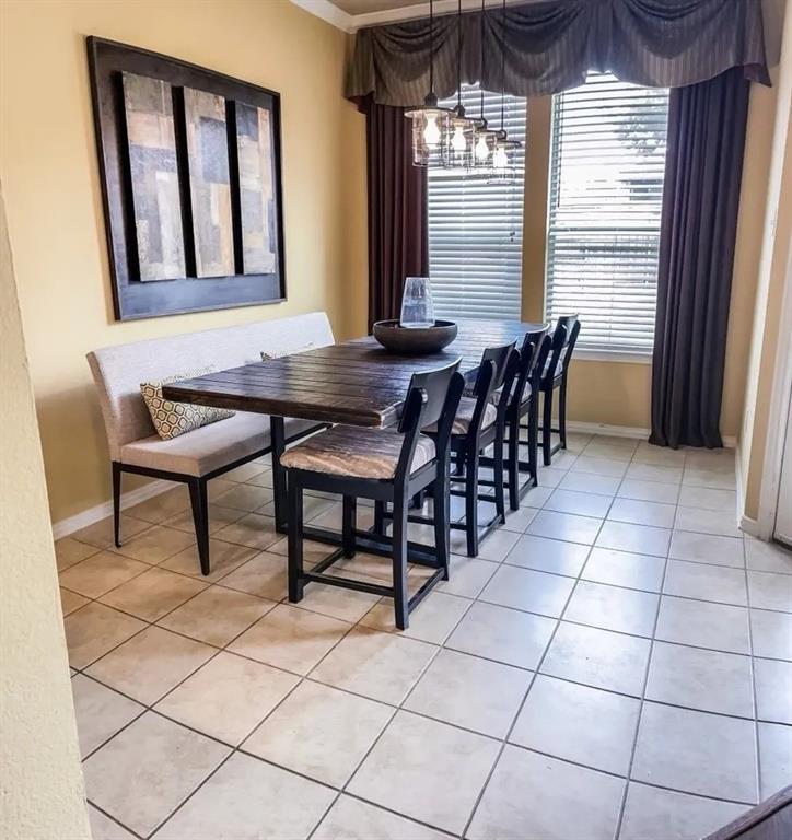 1391 Riverside Oaks Drive Rockwall, TX 75087 - Photo 13 of 32 a dining room with furniture and window