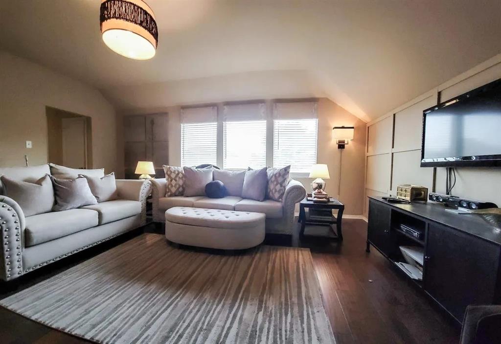 1391 Riverside Oaks Drive Rockwall, TX 75087 - Photo 14 of 32 a living room with furniture a fireplace and a window