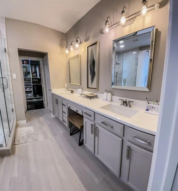 1391 Riverside Oaks Drive Rockwall, TX 75087 - Photo 23 of 32 a spacious bathroom with a double vanity sink a mirror and a shower