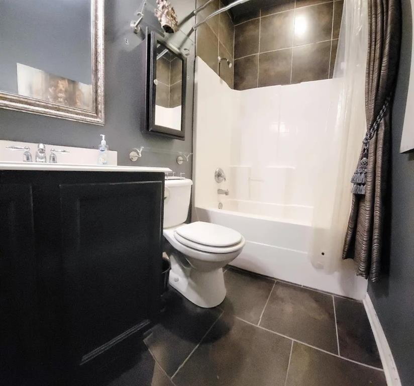 1391 Riverside Oaks Drive Rockwall, TX 75087 - Photo 27 of 32 a bathroom with a granite countertop sink toilet and shower