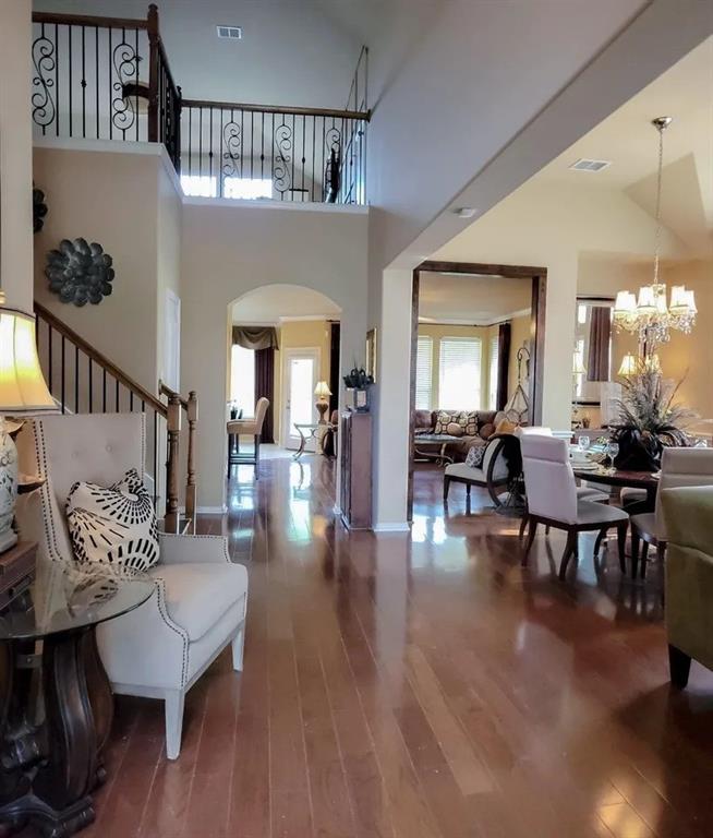 1391 Riverside Oaks Drive Rockwall, TX 75087 - Photo 3 of 32 a living room with furniture and a dining table