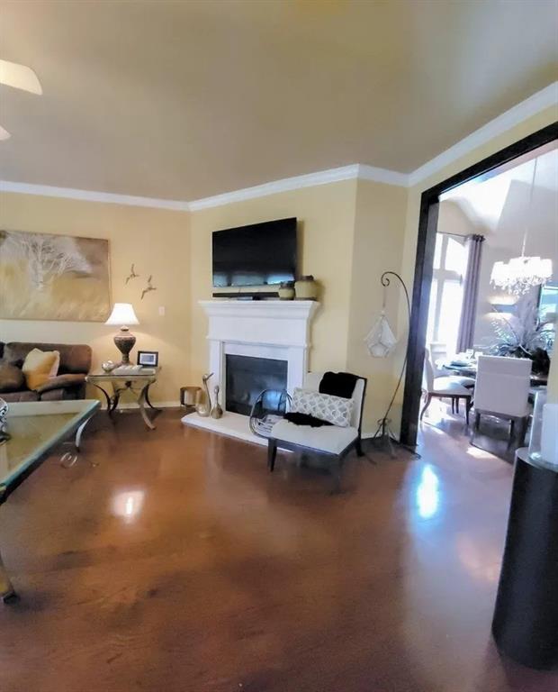 1391 Riverside Oaks Drive Rockwall, TX 75087 - Photo 5 of 32 a living room with furniture a fireplace and a flat screen tv
