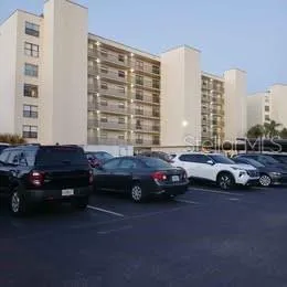 a view of street with parked cars