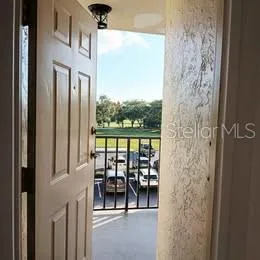 a view of a balcony with furniture and city view