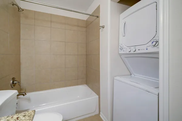 a bathroom with a sink a toilet and bathtub