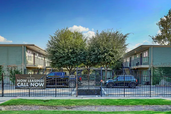 a view of a wrought iron fences in front of a house