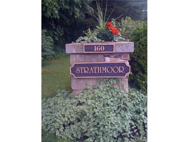 160 Fairfield Woods Road, Unit 34 Fairfield, CT 06825 - Photo 1 of 1 a sign that is sitting on a brick wall