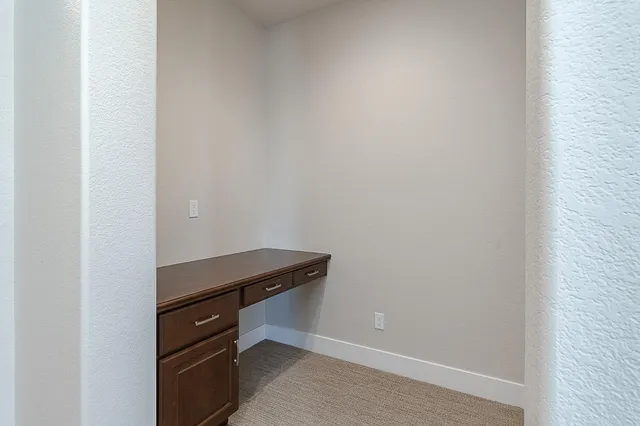 a room with a bench and a table