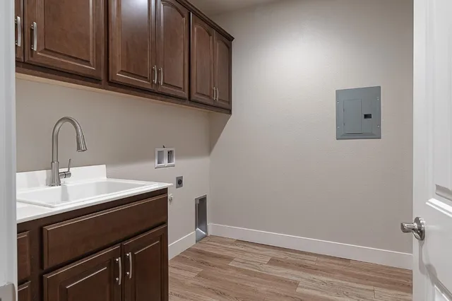 a kitchen with a sink cabinets and appliances
