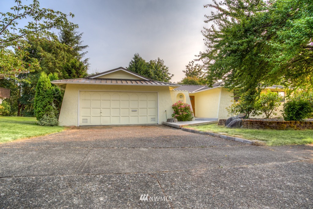 2833 Morris Avenue South Renton, WA 98055 - Photo 1 of 16 a front view of a house with a yard and garage