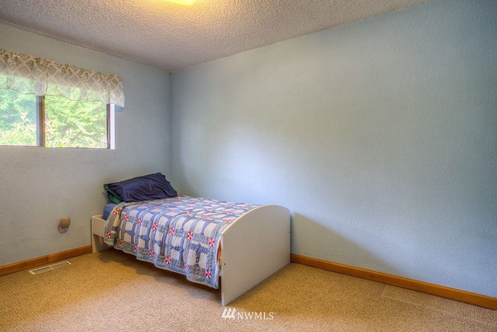 2833 Morris Avenue South Renton, WA 98055 - Photo 11 of 16 a bedroom with a bed and window