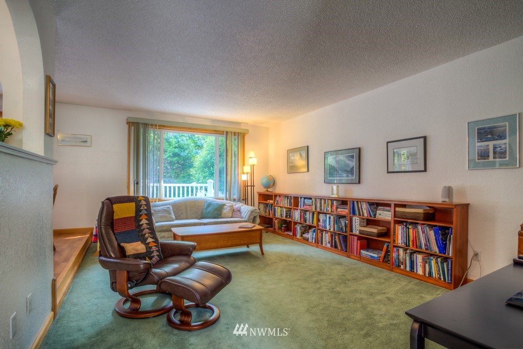 2833 Morris Avenue South Renton, WA 98055 - Photo 13 of 16 a living room with furniture a bookshelf and a window