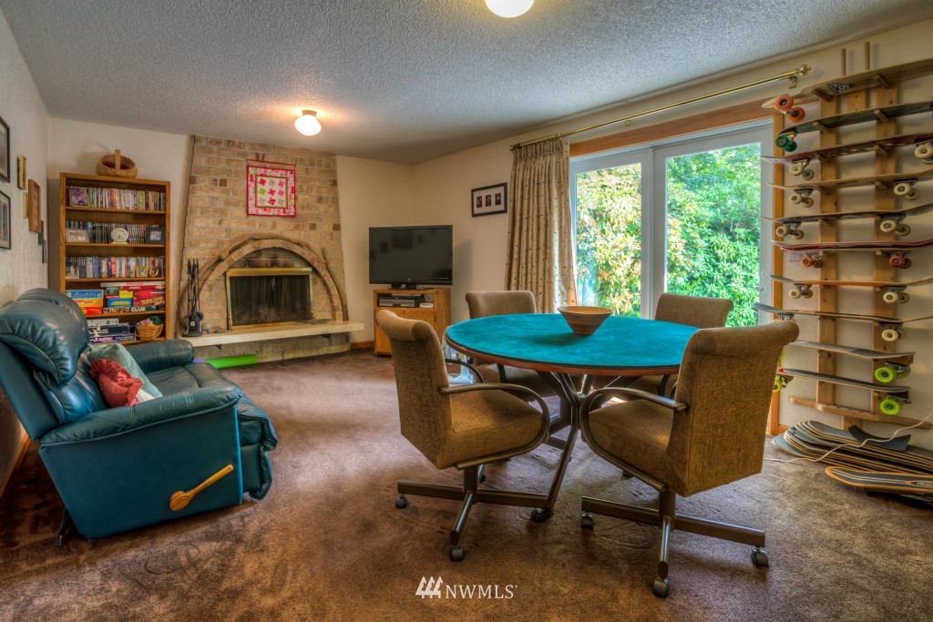 2833 Morris Avenue South Renton, WA 98055 - Photo 4 of 16 a living room with fireplace furniture and a flat screen tv