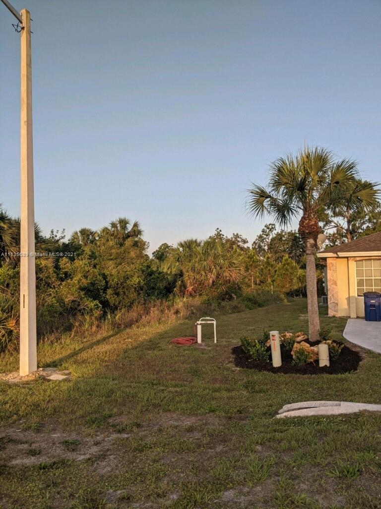 3973-3975 Sunset Road Lehigh Acres, FL 33971 - Photo 3 of 14 a view of a town with mountains in the background