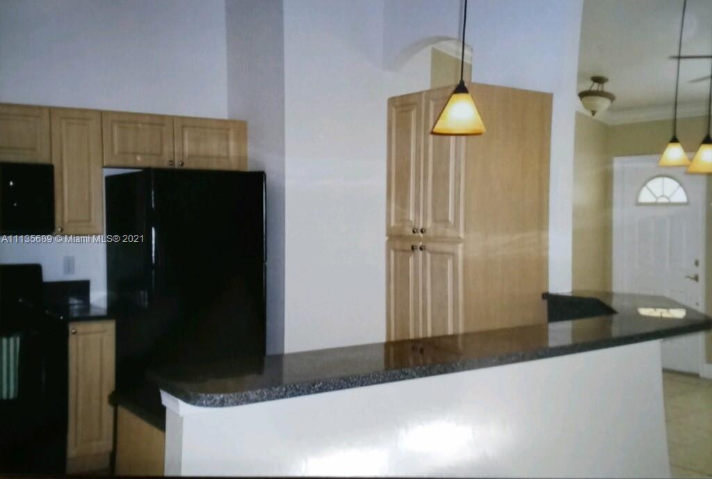 3973-3975 Sunset Road Lehigh Acres, FL 33971 - Photo 5 of 14 a bathroom with a sink and a mirror
