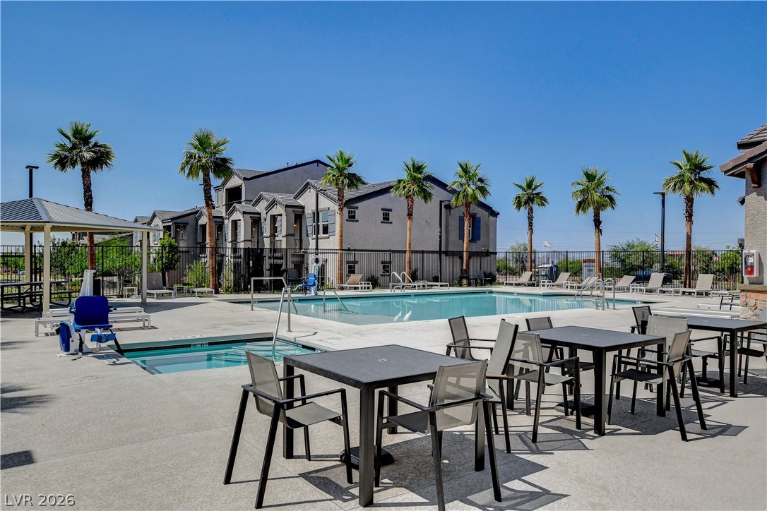 484 Filaree Place Henderson, NV 89015 - Photo 59 of 71 Enjoy the refreshing pool and outdoor space, perfect for relaxation and recreation under sunny skies.