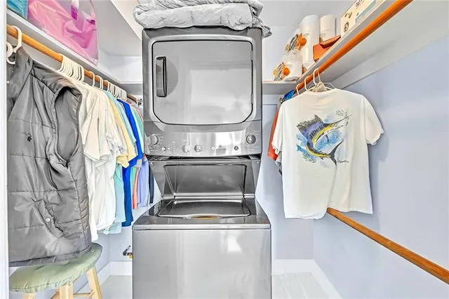 a bathroom with a granite countertop sink mirror vanity and toilet