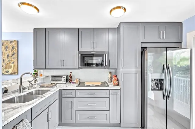 a kitchen with a sink and cabinets