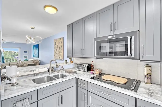 a spacious bathroom with a sink and a mirror