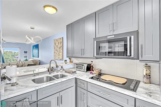 a kitchen with a sink and cabinets