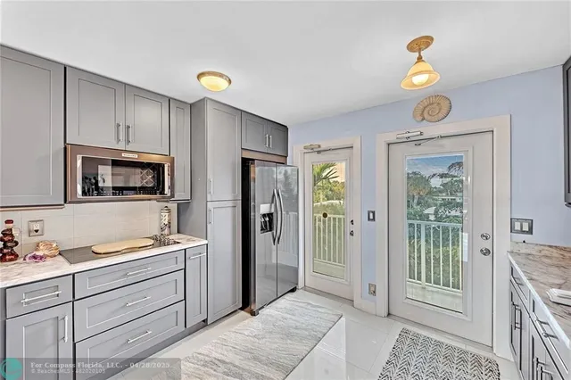 a view of kitchen with wooden floor and window