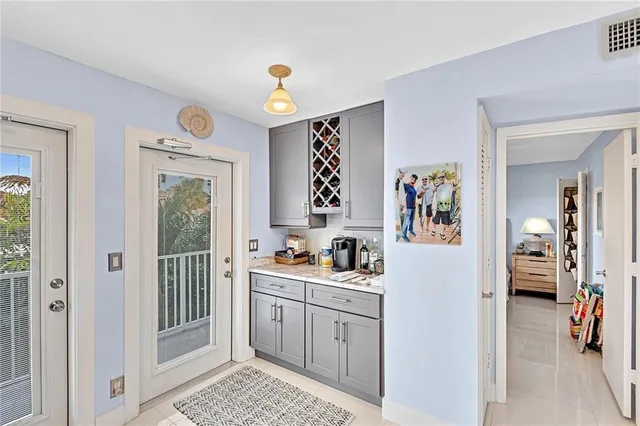 a view of a dining room with furniture wooden floor and a chandelier