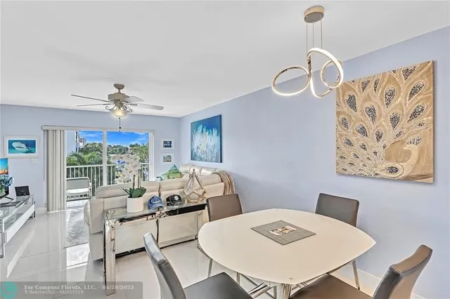a view of a dining room with furniture wooden floor and a chandelier