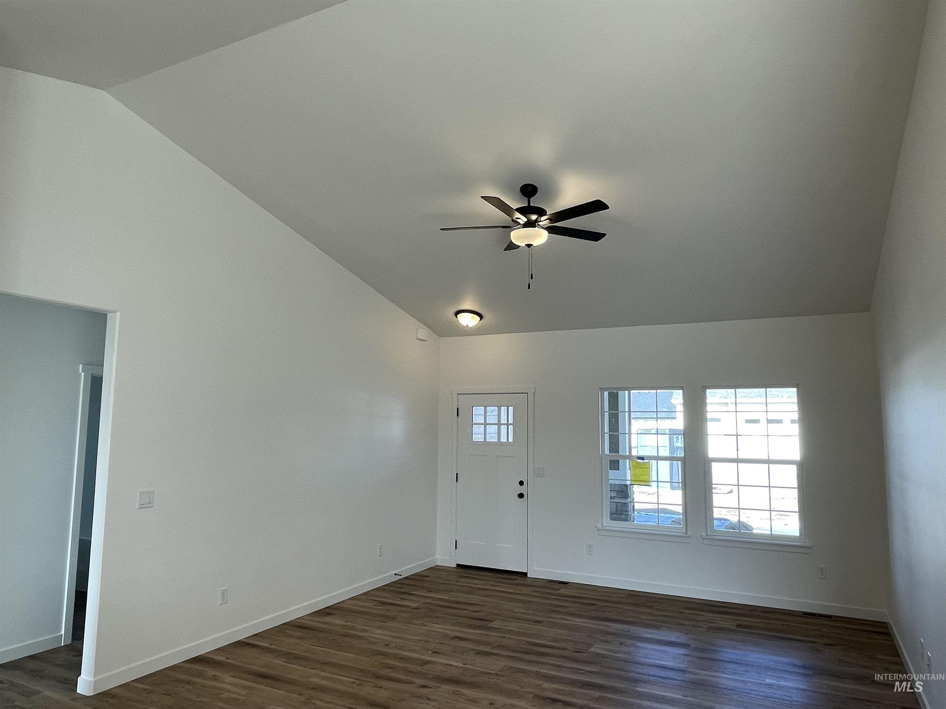 917 Quartz Road Kimberly, ID 83341 - Photo 5 of 12 Entryway with vaulted ceiling, dark wood-style floors, and a ceiling fan
