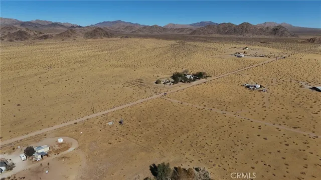 a view of an ocean beach and mountain
