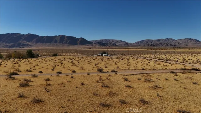 a view of wooden floor and a view of outdoor space