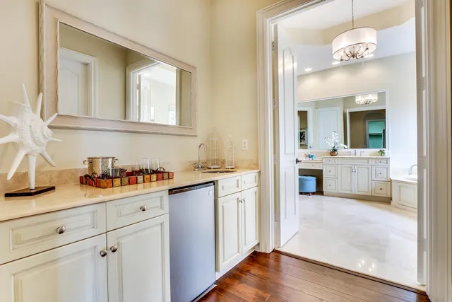 a view of a kitchen counter space and wooden floor