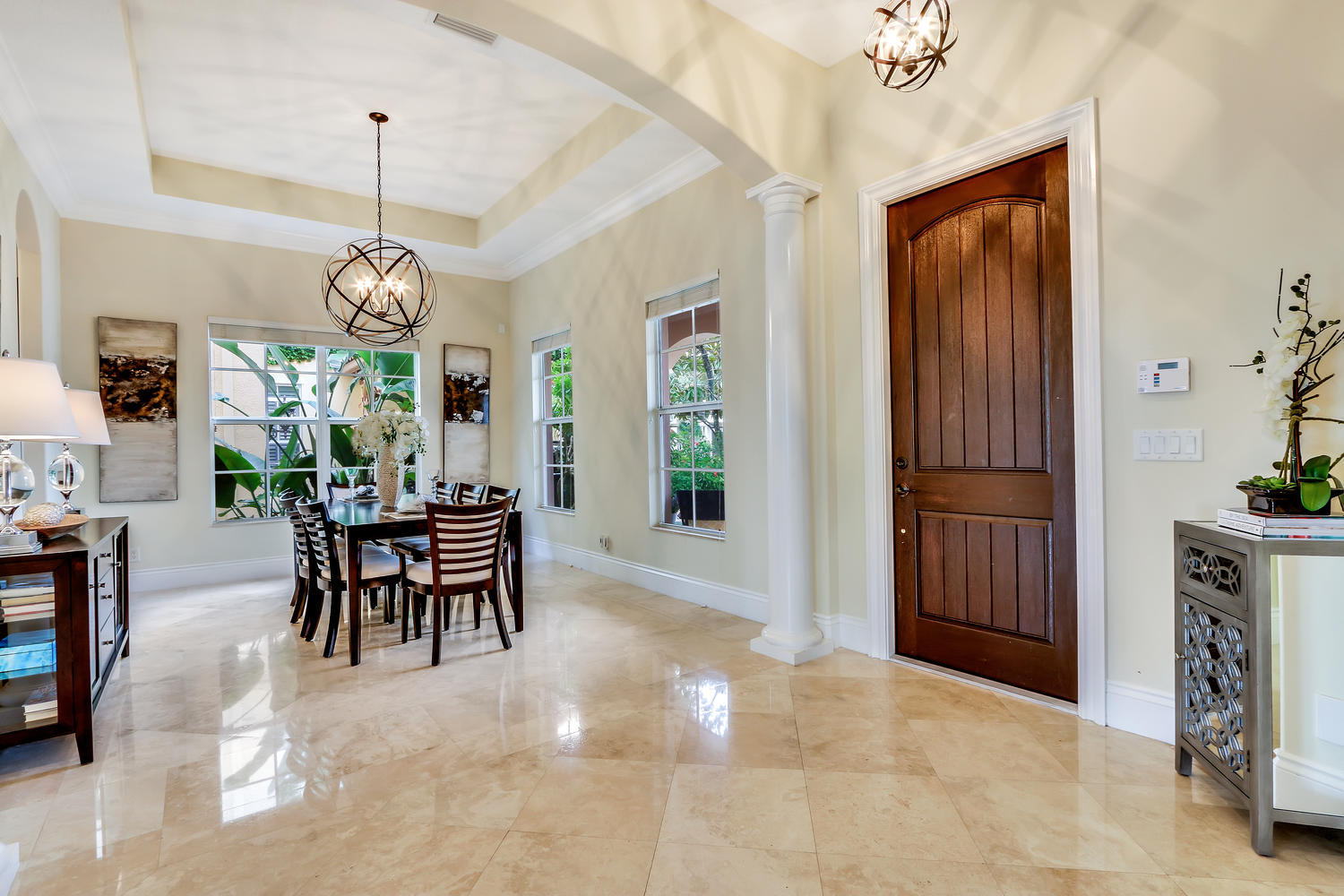 128 Tulip Tree Court Jupiter, FL 33458 - Photo 3 of 35 a view of a dining room with furniture window and wooden floor