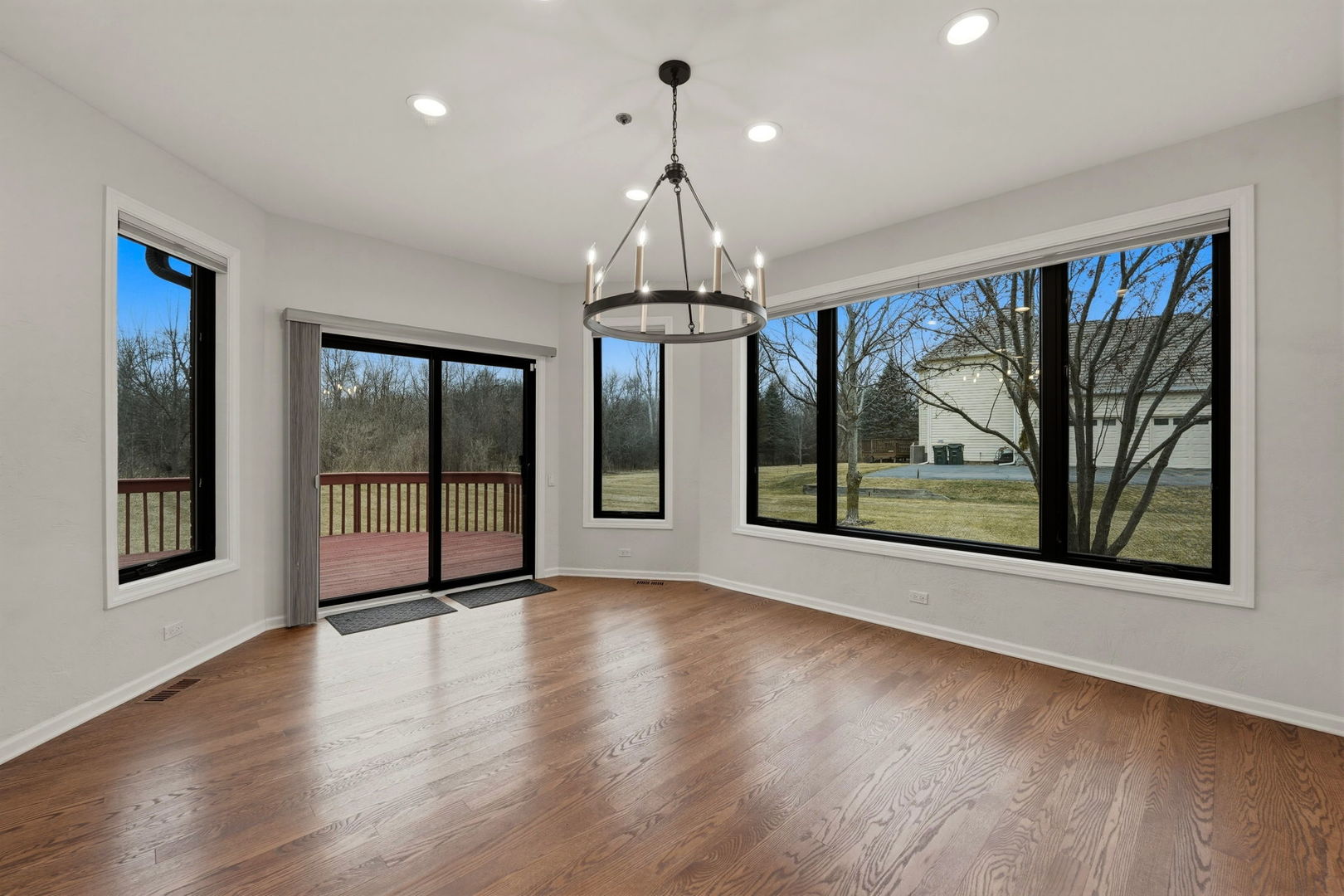 5212 Briarcrest Lane Long Grove, IL 60047 - Photo 15 of 50 a view of an empty room with wooden floor and a window