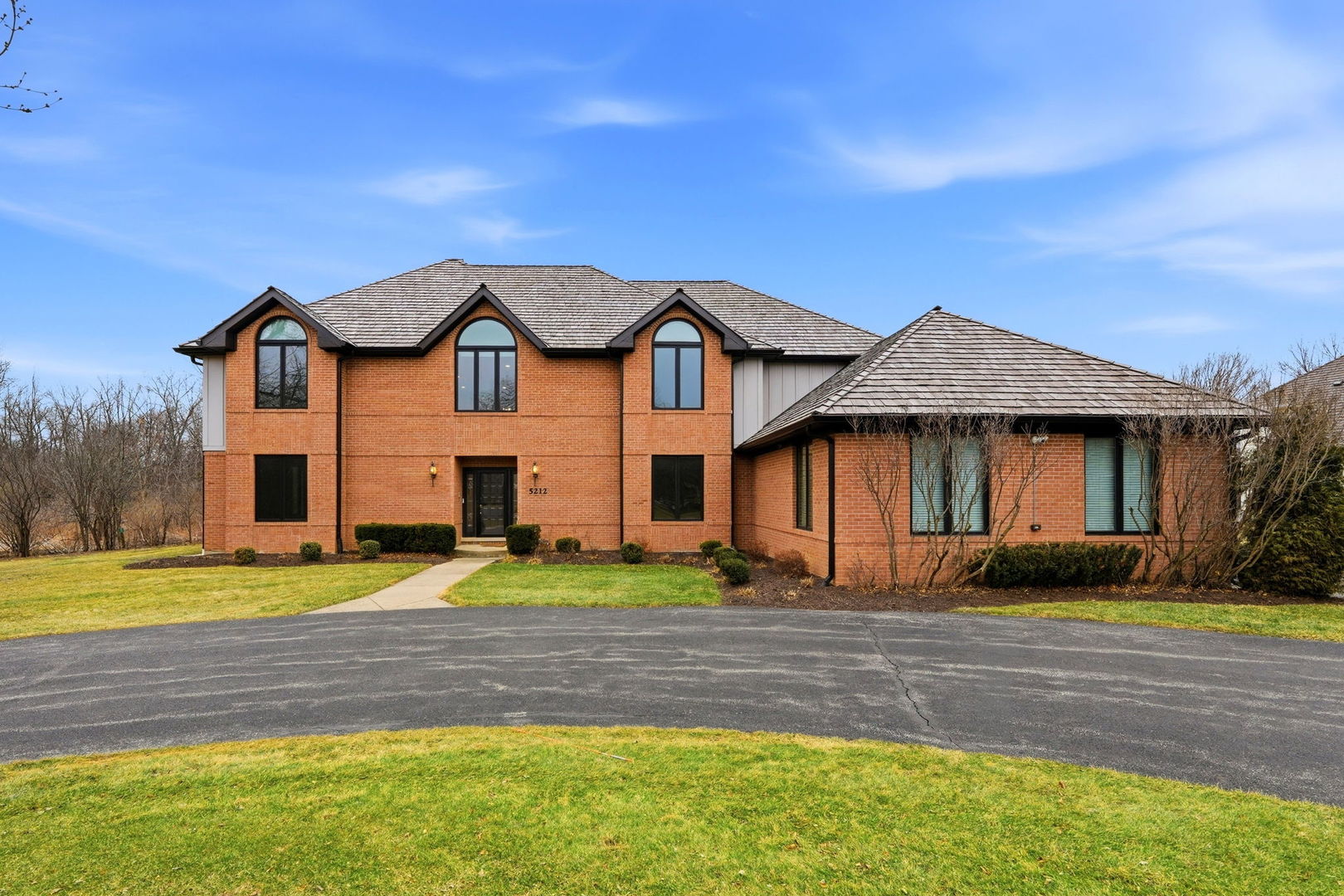 5212 Briarcrest Lane Long Grove, IL 60047 - Photo 2 of 50 a front view of a house with a yard