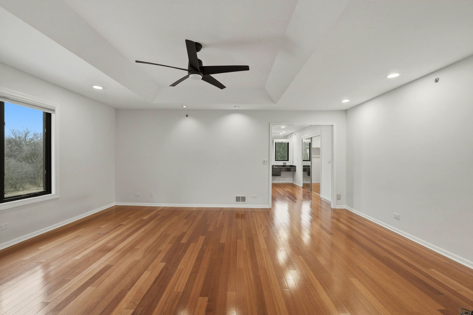 5212 Briarcrest Lane Long Grove, IL 60047 - Photo 23 of 50 a view of empty room with wooden floor and windows