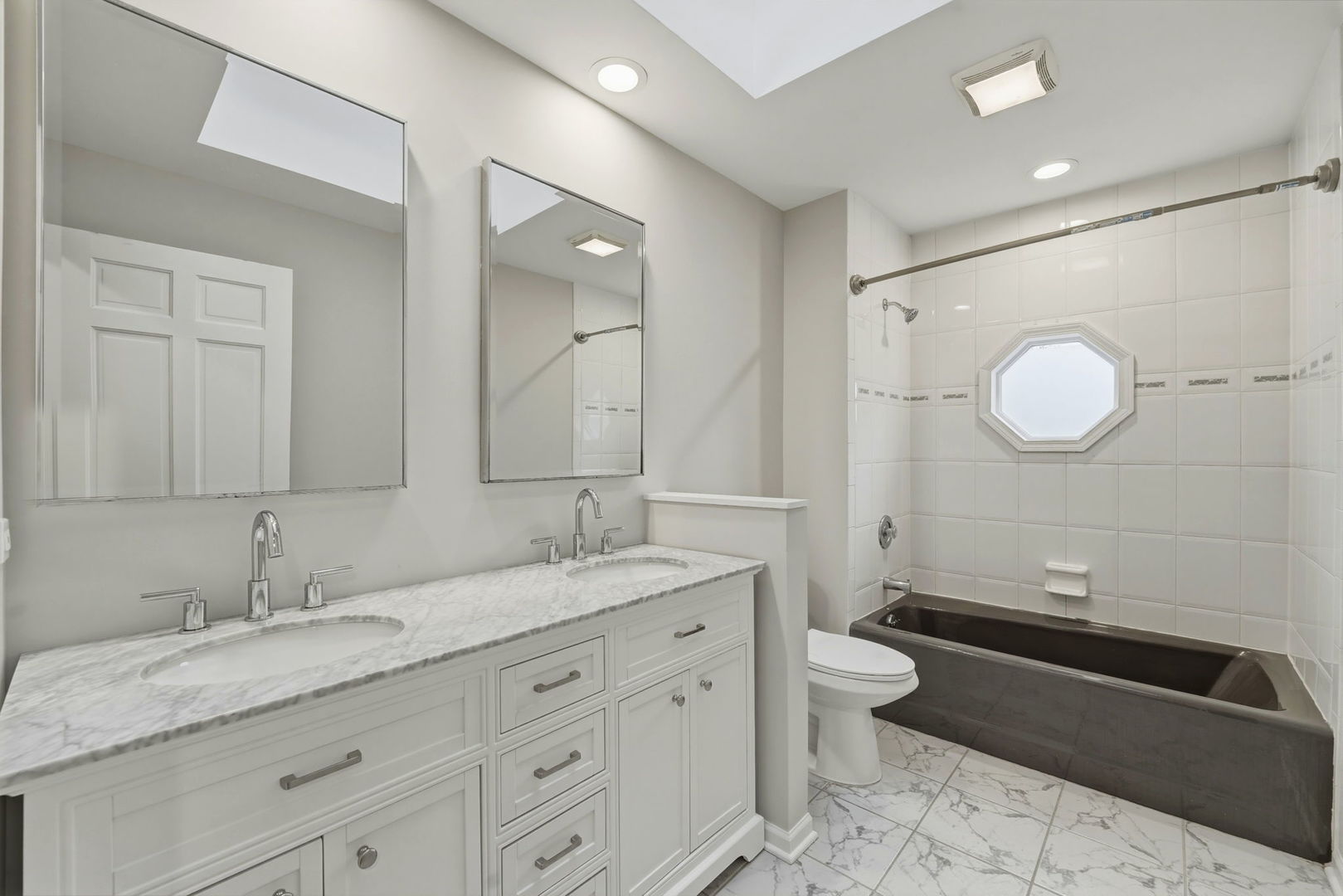 5212 Briarcrest Lane Long Grove, IL 60047 - Photo 32 of 50 a spacious bathroom with a granite countertop double vanity sink and mirror with bathtub